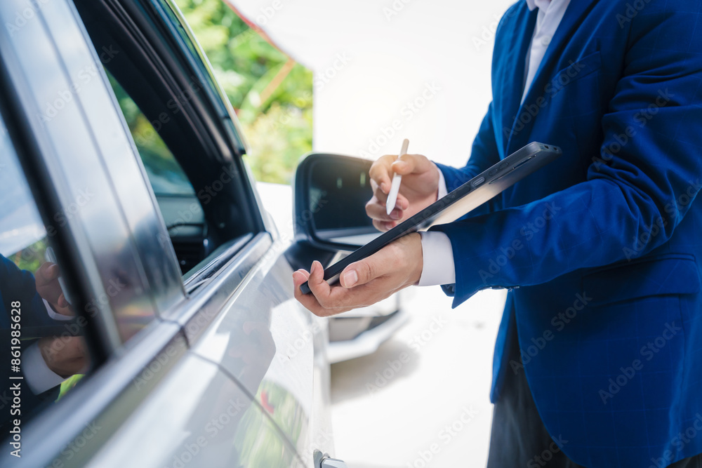 businessman in suit and car auto insurance agent assess car damage, discussing deductible, claims, coverage options comprehensive and collision insurance, completing necessary forms and appraisals. businessman in suit and car auto insurance agent assess car damage, discussing deductible, claims, coverage options comprehensive and collision insurance, completing necessary forms and appraisals.