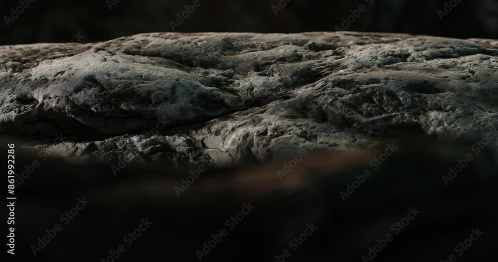 Weathered Stone on Shore at Dusk. Close-up, shallow dof. Weathered Stone on Shore at Dusk. Close-up, shallow dof.