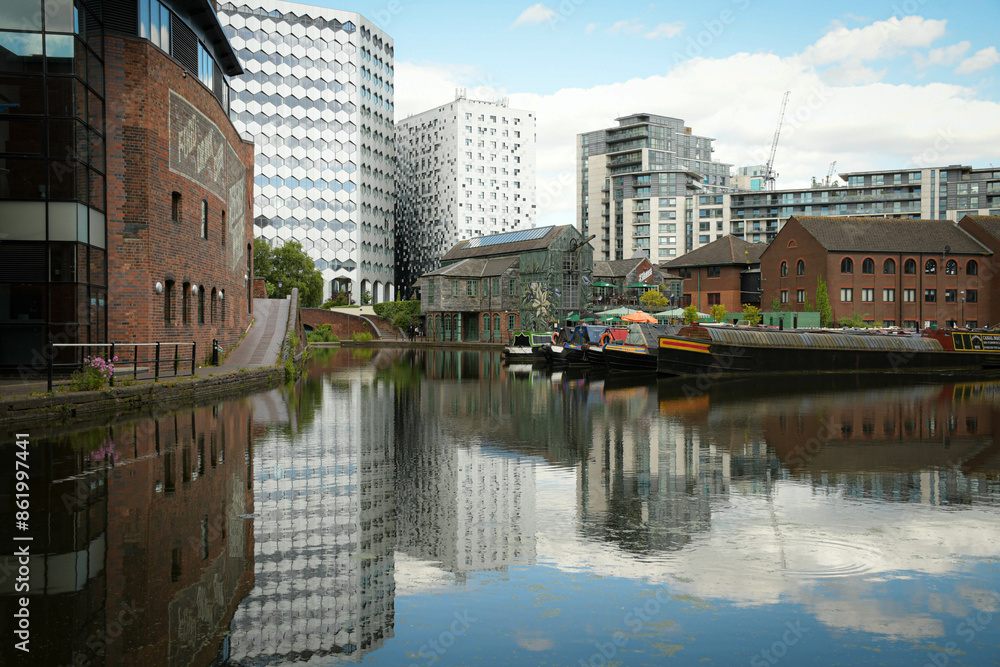 Fototapeta premium Reflections of buildings on the water
