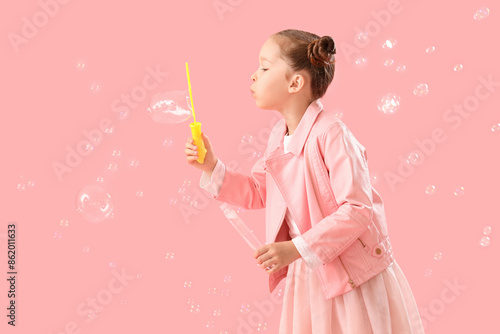 Cute little girl blowing so...