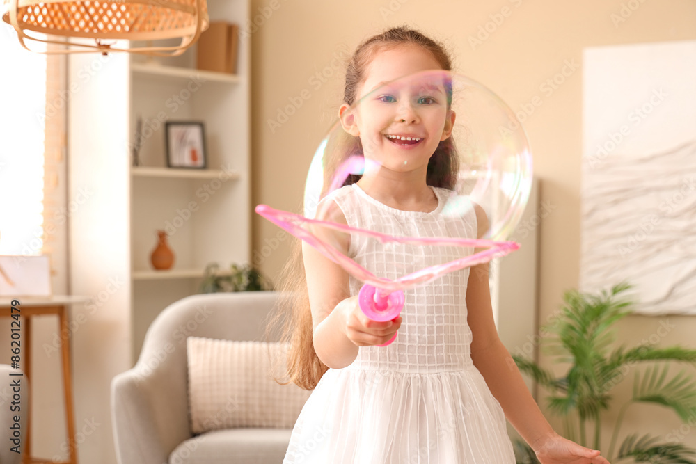 Cute little girl making soap bubble at home Cute little girl making soap bubble at home