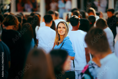 Wallpaper Mural Smiling Woman in a Crowded Place Standing Out. Special individual being unique in her community opt people 
 Torontodigital.ca