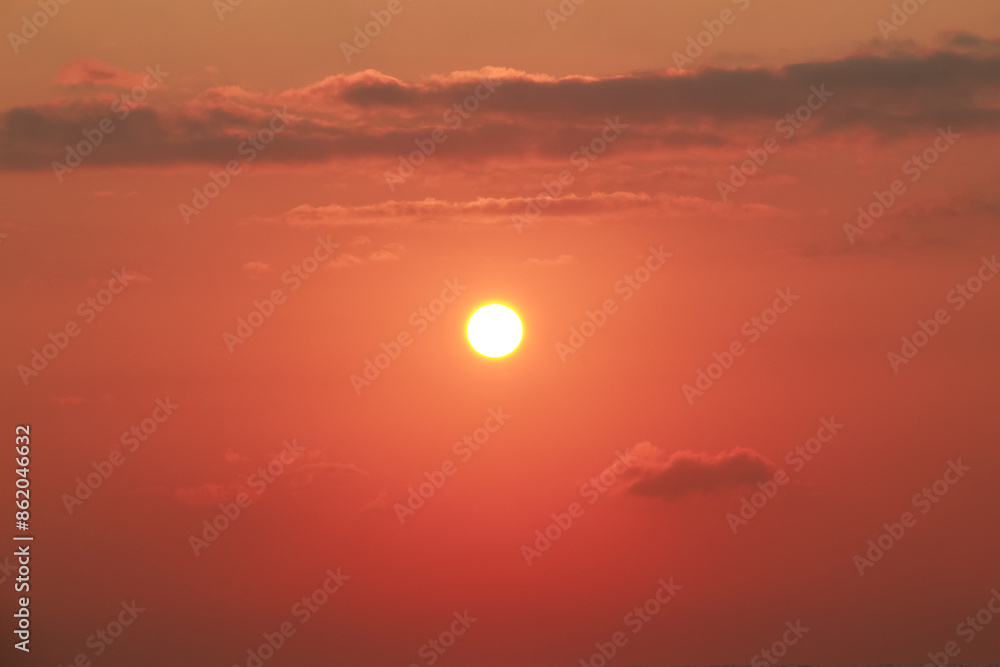 Obraz premium Sunrise on a sunny day with orange sky clouds