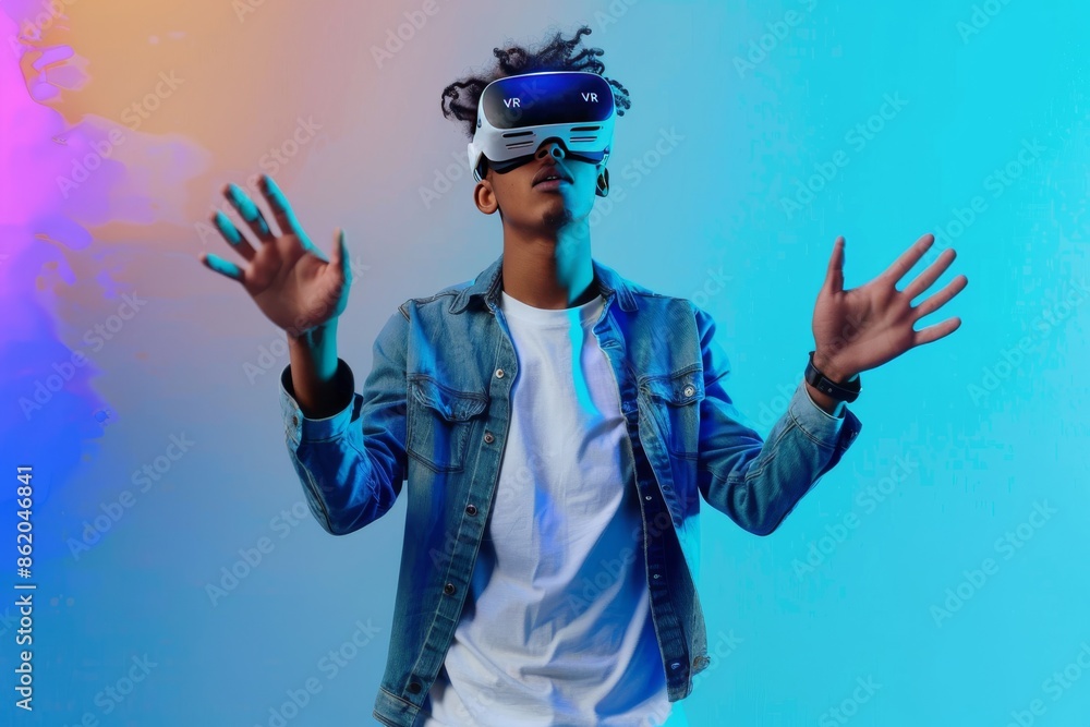 Man enjoying VR in a colorful setting, highlighting the immersive experience and advanced technology, perfect for showcasing modern digital interaction and entertainment in vibrant environments Man enjoying VR in a colorful setting, highlighting the immersive experience and advanced technology, perfect for showcasing modern digital interaction and entertainment in vibrant environments