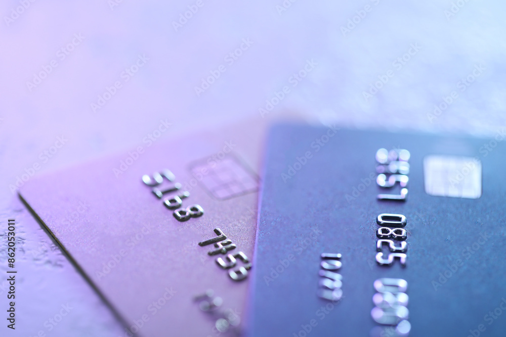 Plastic credit cards on table, closeup view. Color toned Plastic credit cards on table, closeup view. Color toned