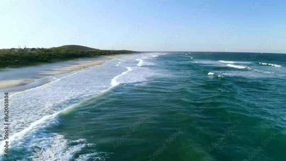 Big waves of deep sea beach, bright blue sky background Big waves of deep sea beach, bright blue sky background