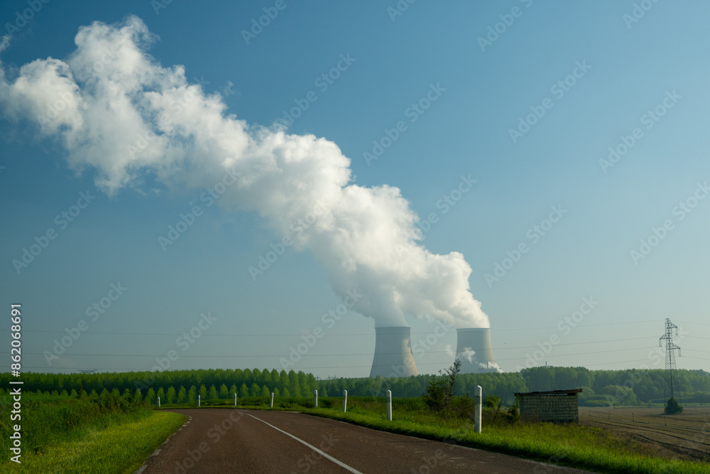 View on cooling towers of nuclear power plant thermal power station in which heat source is nuclear reactor, France, Europe