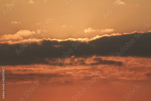 Close up view of sun hidden behind clouds photography