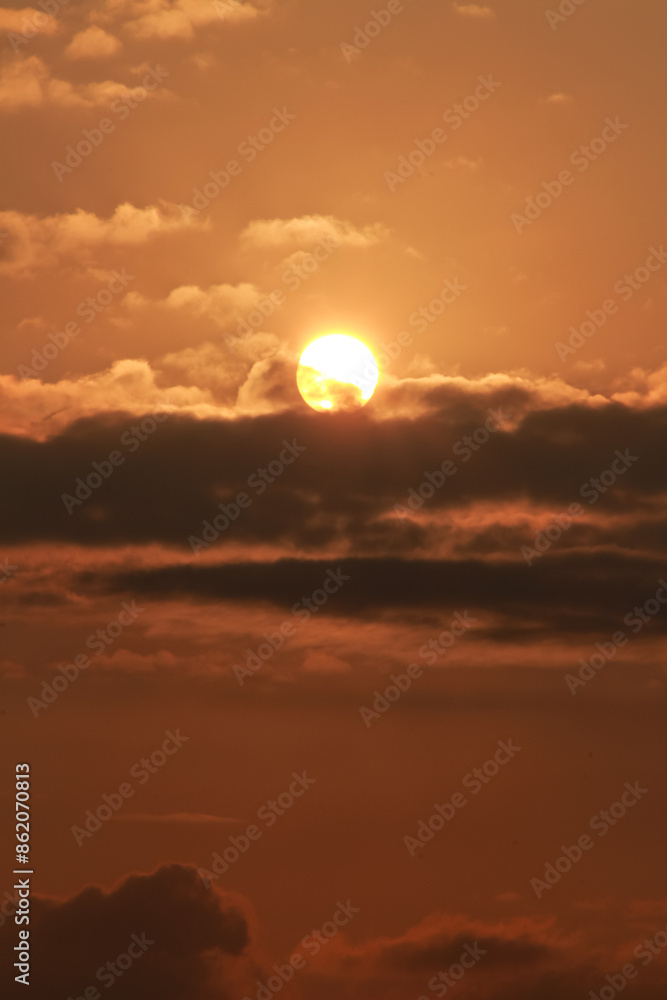 Close up view of sun hidden behind clouds photography Close up view of sun hidden behind clouds photography