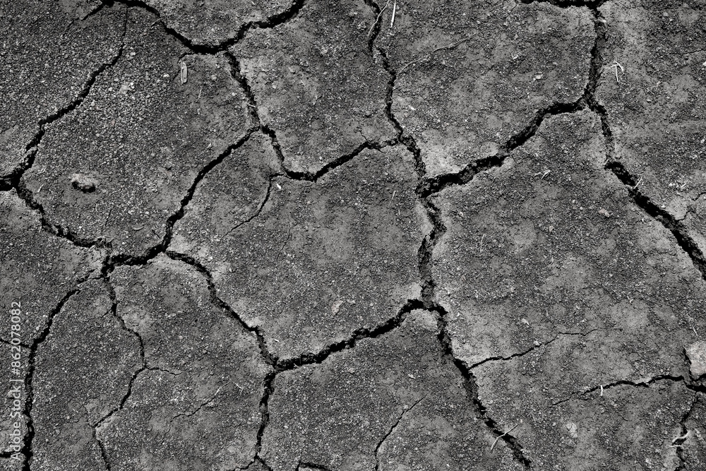 Wall texture soil dry crack pattern of drought lack of water of nature brown old broken background.