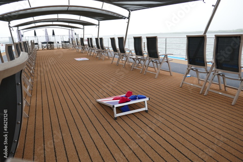 Картината върху платно Corn hole game on upper deck of cruise ship