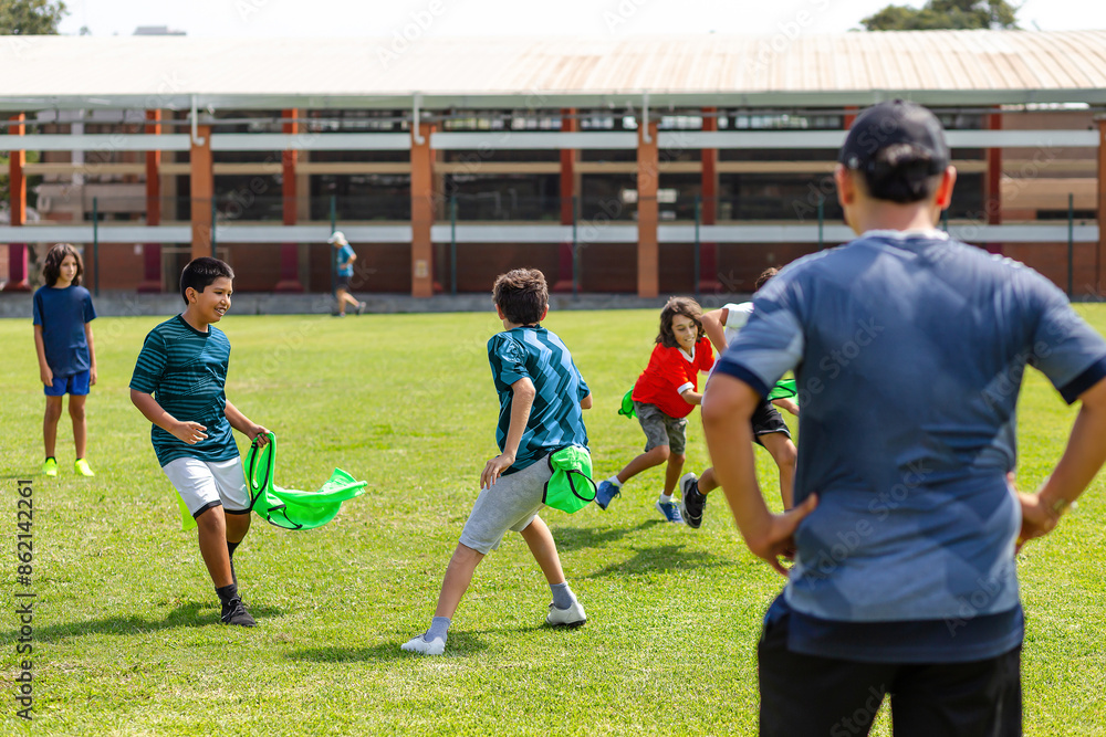 Obraz premium Youth Soccer Match with Colorful Training Bibs