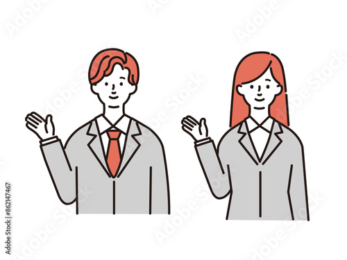 スーツ姿で案内をする若い男女