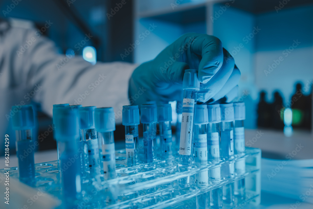 a scientist is working in a laboratory, a chemical researcher is preparing sample for a vaccine against a virus, work in lab concentrate is the most important because chemicals are dangerous a scientist is working in a laboratory, a chemical researcher is preparing sample for a vaccine against a virus, work in lab concentrate is the most important because chemicals are dangerous