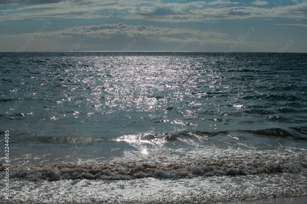 Calm sea water surface texture with splashes and waves. Abstract nature background. Background of aqua ocean water surface. Calm sea water surface texture with splashes and waves. Abstract nature background. Background of aqua ocean water surface.