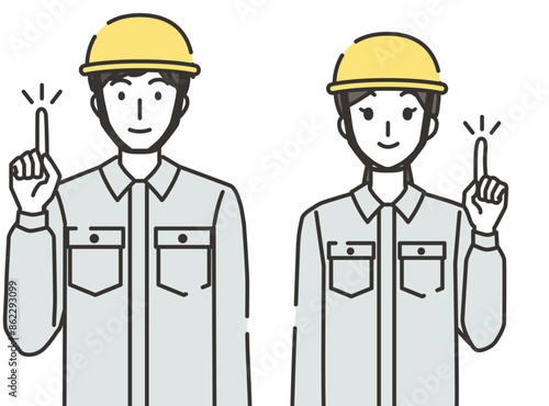 指差しポーズの建設業の男性と女性