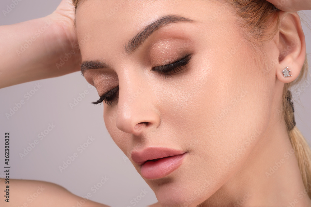 Obraz na plátně High fashion of perfect beautiful young woman on isolated studio background
