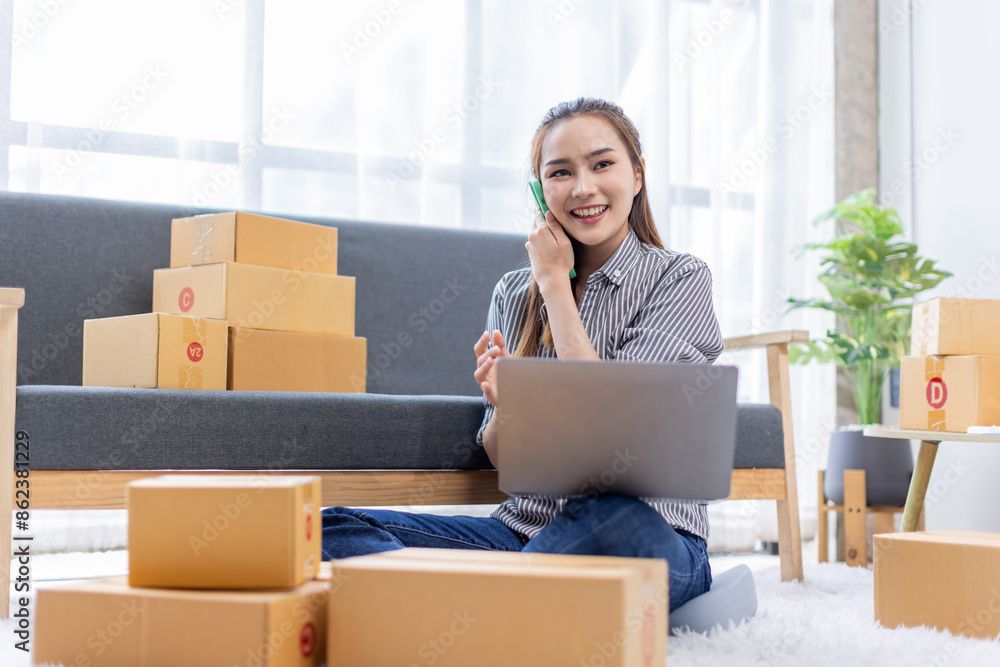 asian young woman owner packing product box prepare to the package for delivery to the customer on sofa at home office asian Entrepreneur SME business concept. asian young woman owner packing product box prepare to the package for delivery to the customer on sofa at home office asian Entrepreneur SME business concept.