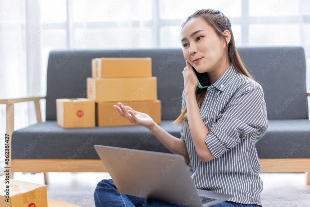 asian young woman owner packing product box prepare to the package for delivery to the customer on sofa at home office asian Entrepreneur SME business concept. asian young woman owner packing product box prepare to the package for delivery to the customer on sofa at home office asian Entrepreneur SME business concept.