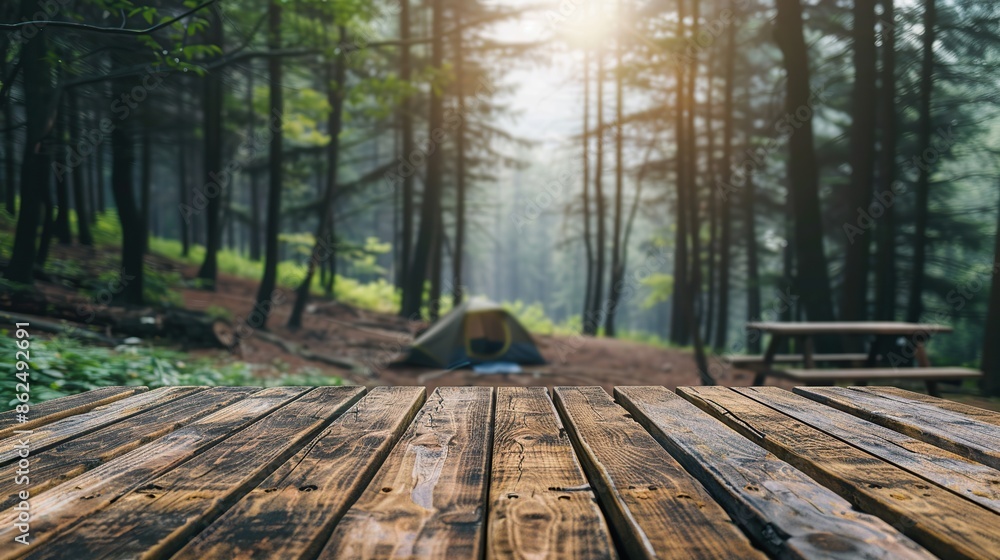 Camping wooden tabletop, empty wood table top in green forest, concept of outdoor nature activity dais podium counter product display platform mockup background banner. Camping wooden tabletop, empty wood table top in green forest, concept of outdoor nature activity dais podium counter product display platform mockup background banner.