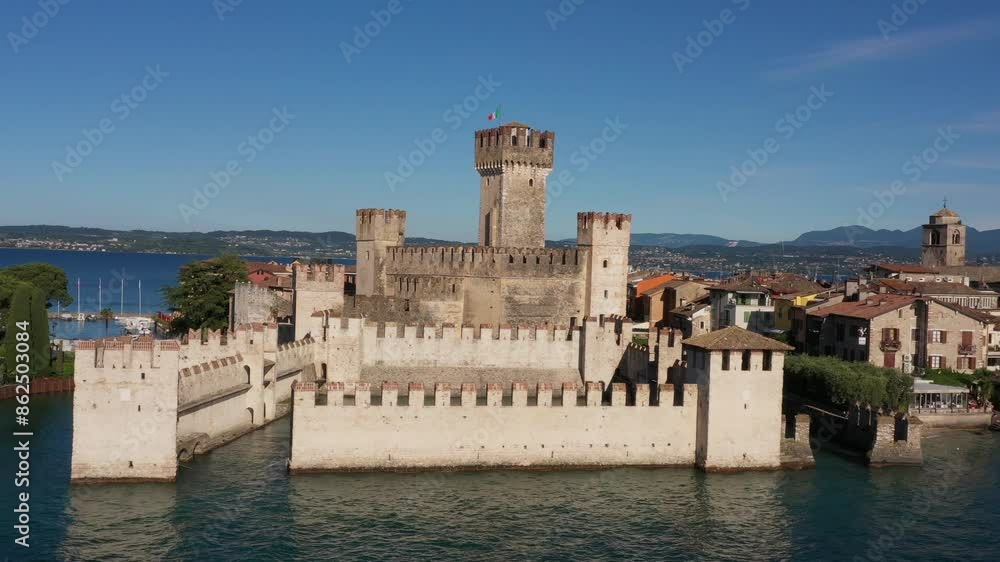 Point of interest aerial view of the historic city of Sirmione, Lake Garda, Italy. Cinematic 4K aerial drone Scaligero Castle of Sirmione. 4K aerial drone Scaligero Castle of Sirmione. Point of interest aerial view of the historic city of Sirmione, Lake Garda, Italy. Cinematic 4K aerial drone Scaligero Castle of Sirmione. 4K aerial drone Scaligero Castle of Sirmione.