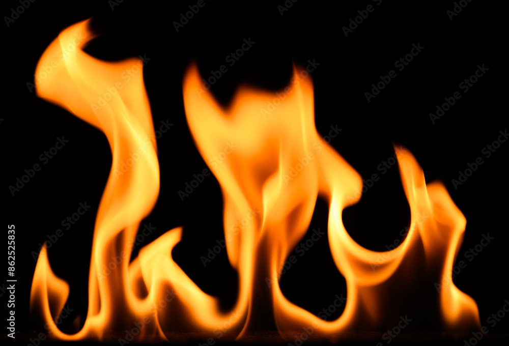 fire on a black background, burning and hot flames, close view fire on a black background, burning and hot flames, close view