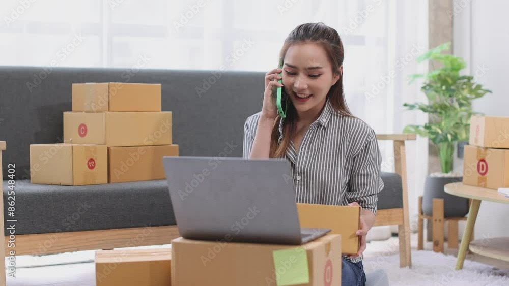 asian young woman owner packing product box prepare to the package for delivery to the customer on sofa at home office asian Entrepreneur SME business concept. asian young woman owner packing product box prepare to the package for delivery to the customer on sofa at home office asian Entrepreneur SME business concept.