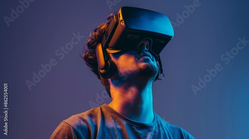 Background with a man in VR glasses. Augmented reality helmet. Virtual reality glasses. Modern technologies. Future technologies © Katsyarina