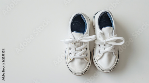 Adorable toddler shoes reminiscent of classic school footwear, set against a pristine white backdrop. photo
