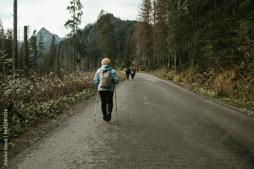 Hiking, Mature caucasian senior woman in nature for exercise, holiday walking and enjoying the mountains. Travel, retirement and an elderly man and woman on a walk in the woods or forest for trekking Hiking, Mature caucasian senior woman in nature for exercise, holiday walking and enjoying the mountains. Travel, retirement and an elderly man and woman on a walk in the woods or forest for trekking