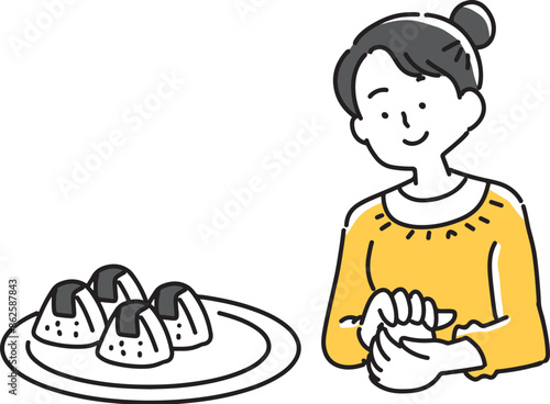 おにぎりを握る女性