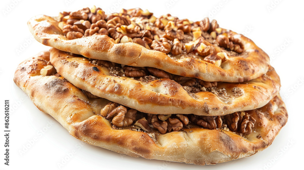 Fototapeta premium Thin Turkish flatbread topped with walnuts, isolated on white background.