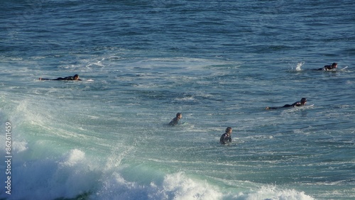 Surfing / Riding waves at Banana Beach Agadir Morocco photo