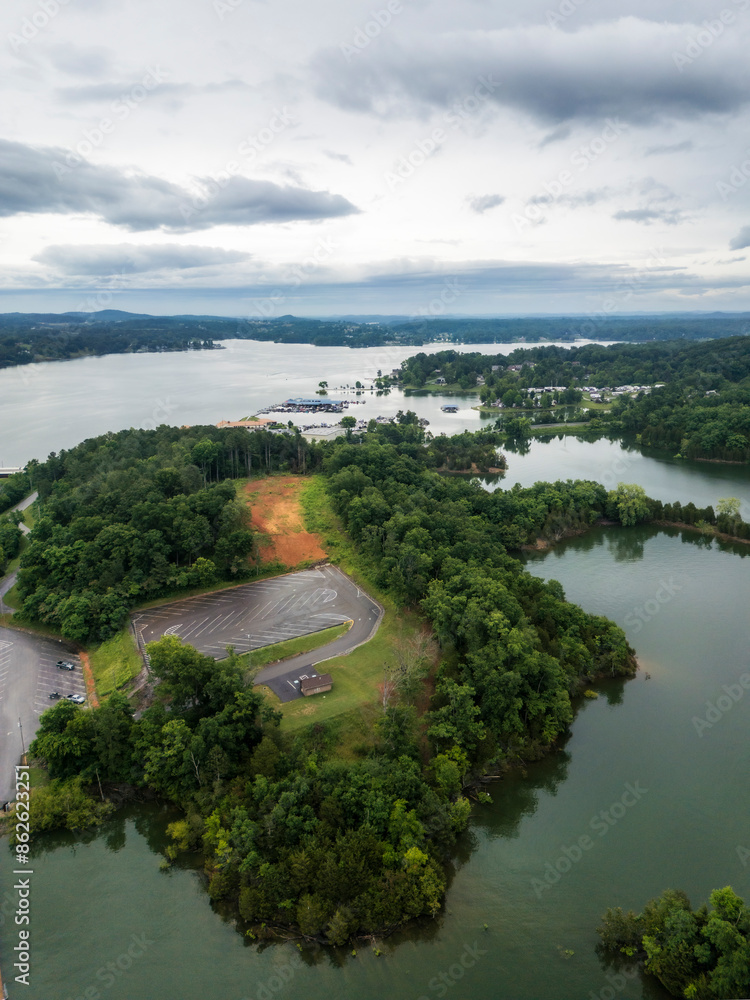 Aerial view of serene lake surrounded by lush forest and trees, Dandridge, Tennessee, United States.