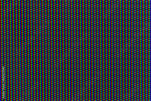 Macro image of pixels of a CRT screen. You will see an arrangement of 3 color dots: red, green, blue (RGB). photo