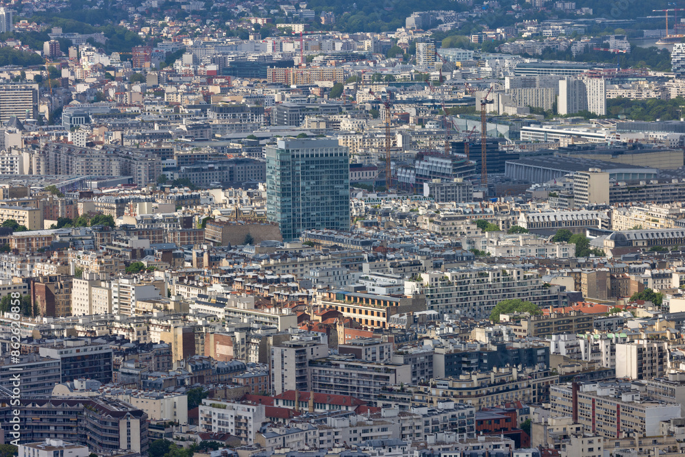 Aerial view of crowded Paris rooftops and skyline, Ile de France, France. Aerial view of crowded Paris rooftops and skyline, Ile de France, France.