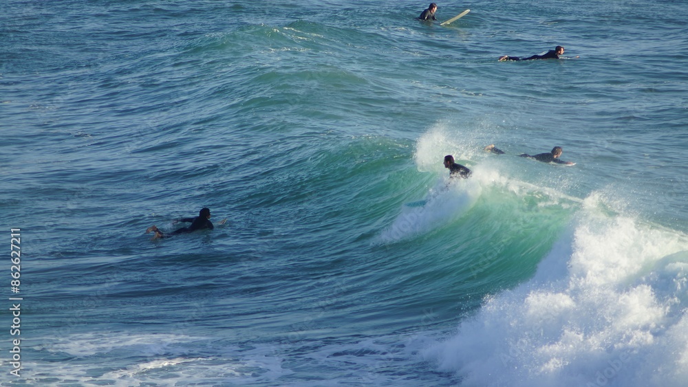 Fototapeta premium Surfing / Riding waves at Banana Beach Agadir Morocco