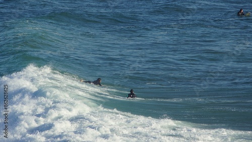 Surfing / Riding waves at Banana Beach Agadir Morocco photo