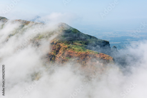 Aerial view of majestic Harishchandragad with mist and rock, Nashik district, India. photo