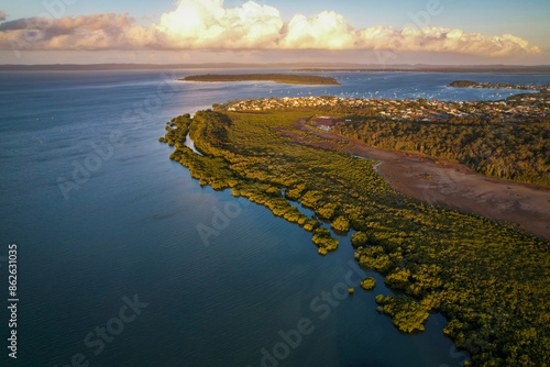 Aerial view of lush forest and mangroves along the coast of Moreton Bay, Coochiemudlo Island, Victoria Point, Brisbane, Queensland, Australia. photo