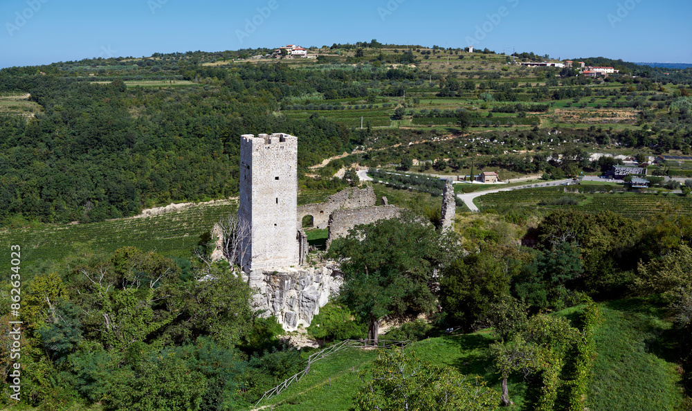 Aerial view of Medieval fortress with tower and ruins amidst greenery and trees, Momjan, Istria, Croatia. Aerial view of Medieval fortress with tower and ruins amidst greenery and trees, Momjan, Istria, Croatia.