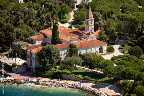 Aerial view of Franciscan Monastery, church, garden, trees, and ocean, Crveni otok, Rovinj, Istria, Croatia. photo