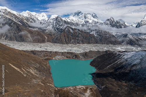 Aerial view of Gokyo lake surrounded by snow-capped mountains in Everest mont, Lho tse mont, Khumjung, Province no 1, Nepal. photo