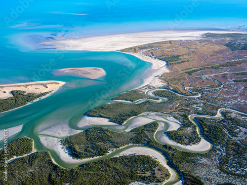 Aerial view of lush coastal landscape along Roebuck Bay, Western Australia.