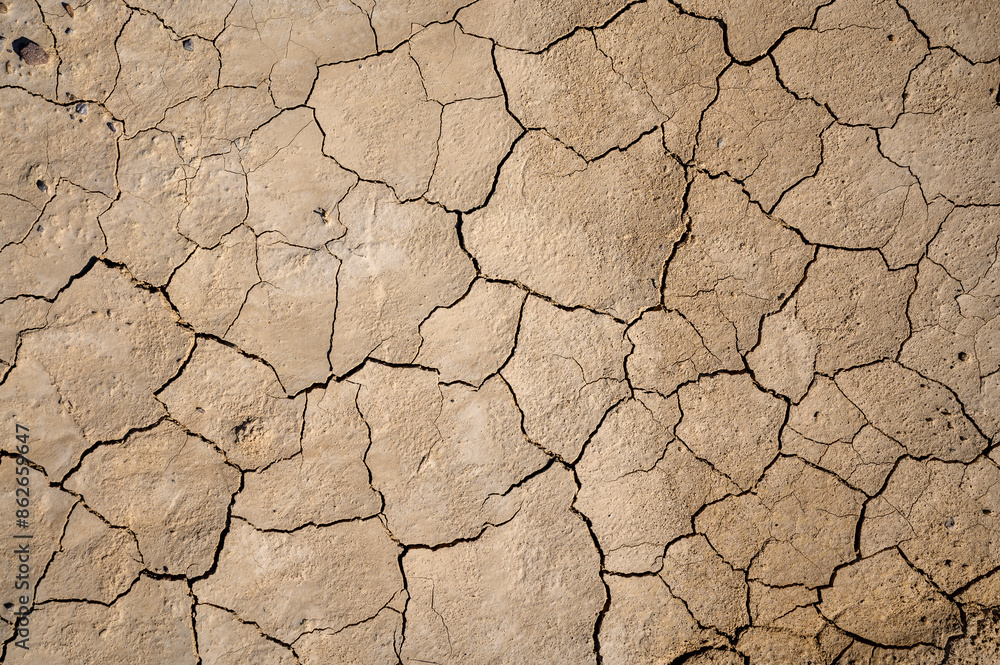 Dried mudflat with cracks, Bardenas reales national park, Navarro, Spain. Dried mudflat with cracks, Bardenas reales national park, Navarro, Spain.