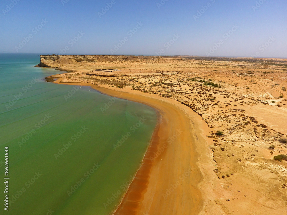 Aerial view of serene sandy beach and rocky shoreline along Paddi Zirr Gulf, Gwadar, Balochistan, Pakistan. Aerial view of serene sandy beach and rocky shoreline along Paddi Zirr Gulf, Gwadar, Balochistan, Pakistan.