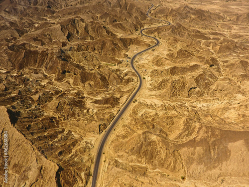 Aerial view of road winding through majestic mountains and valley, Ormara, Balochistan, Pakistan. photo