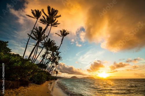 View of tropical sunset at kahala beach, hawaii, united states. photo