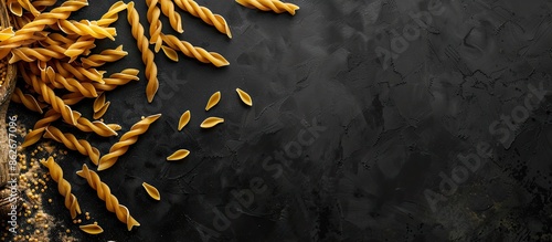Copy space image of dried pasta on a dark backdrop. photo