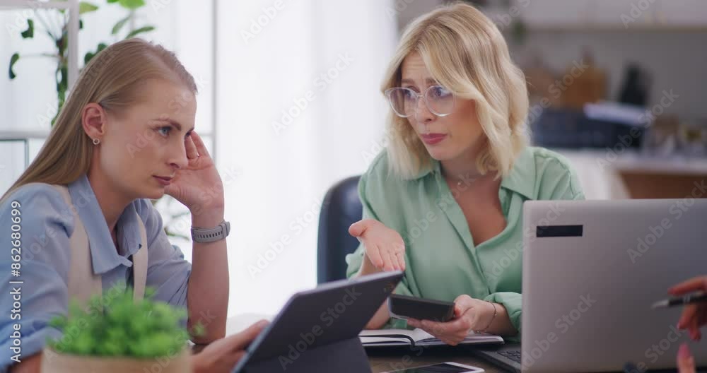 Two Women Discuss Decline in Sales at Business Meeting Two Women Discuss Decline in Sales at Business Meeting
